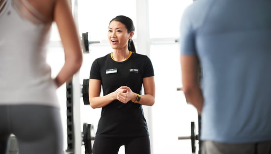 fitness trainer talking to class