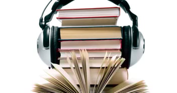 Headphone over a stack of books 