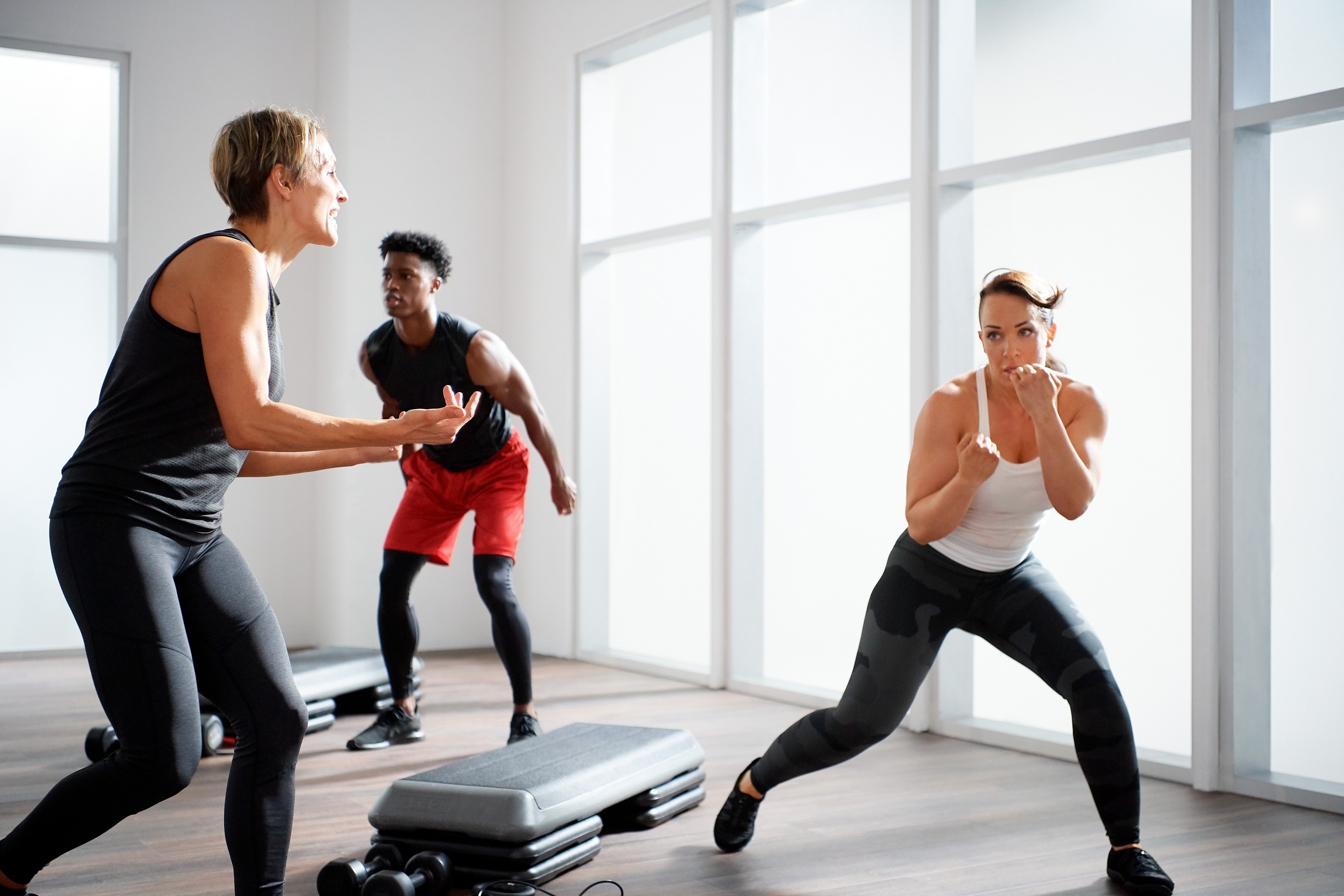 group fitness instructor guiding a punch class